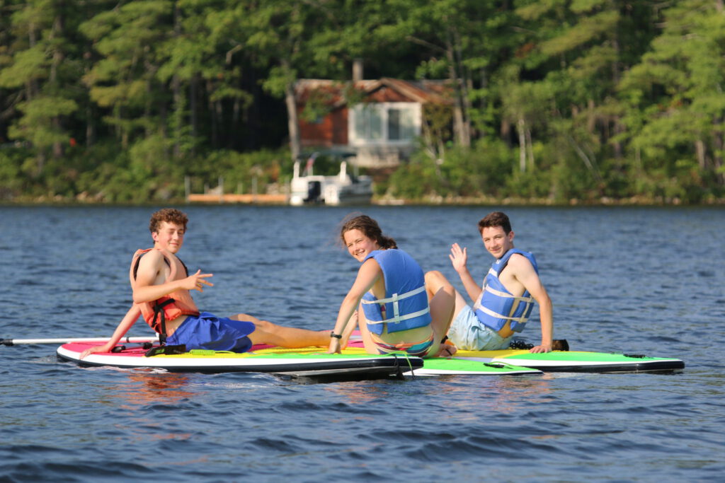Waterfront paddle board chilling 2048x1365 1, Camp Encore Coda