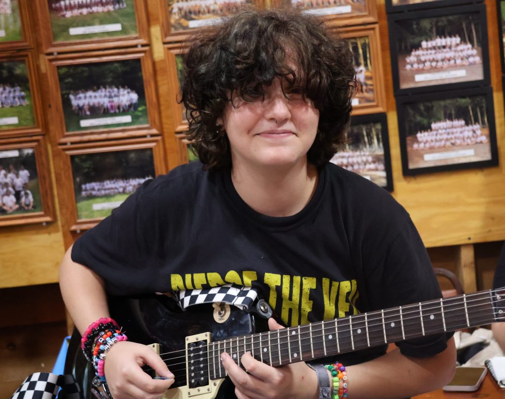 happy guitar scaled e1770318609725, Camp Encore Coda